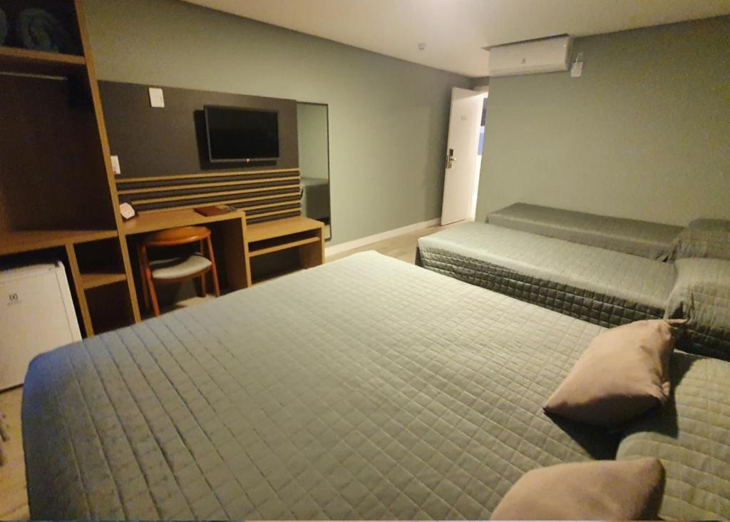 Quarto Quádruplo com Varanda