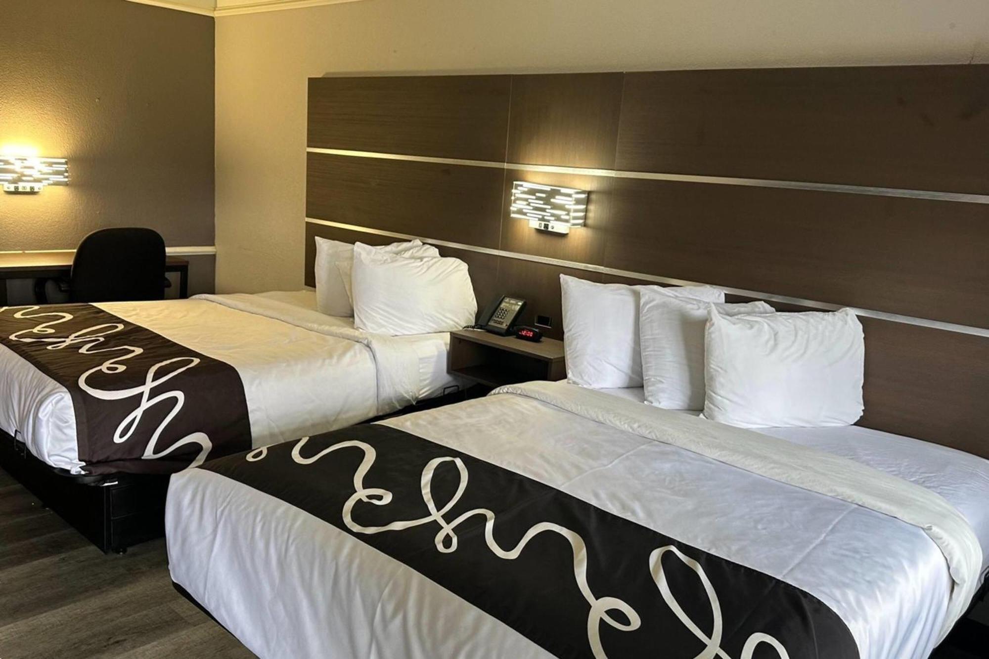 Double Room Two Double Beds Roll Shower Courtyard View Mobility Accessible or Non-Smoking