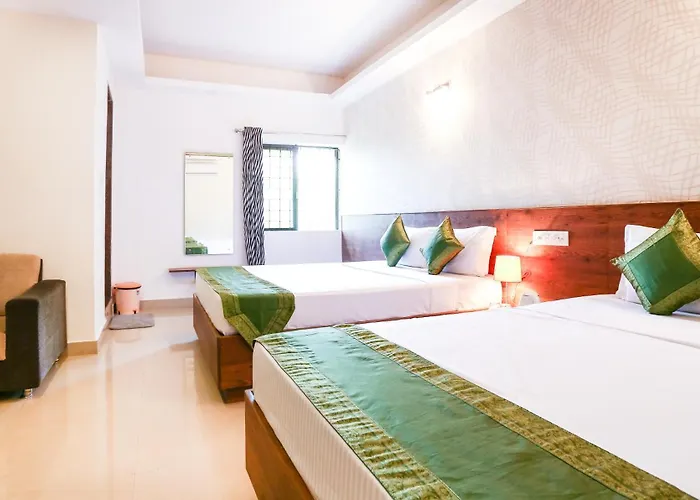 Treebo Comforts Inn, University Road Deralakatte