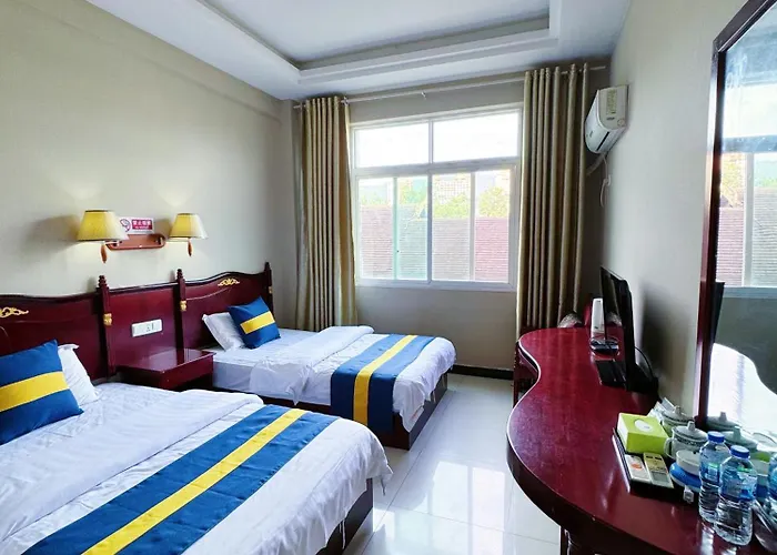 Xishuangbanna International Aerial Garden South Of Mekong River Business Hotel 傣江南商务酒店