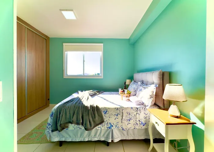 Apartamentos a150 M DA PRAIA com SACADA, WI-FI, PISCINA, PORTARIA 24h, PLAYGROUND e vaga de GARAGEM